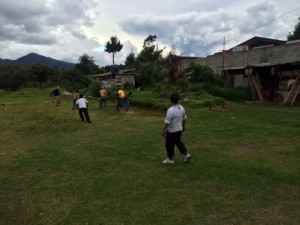 Pastor Santiago Rosales plays soccer with some men of the church.