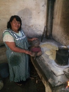 The pastors wife Eluvia making the daily supply of tortillas.