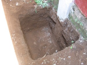 The deeper the better. This hole will be filled with rocks, cement and rebar.